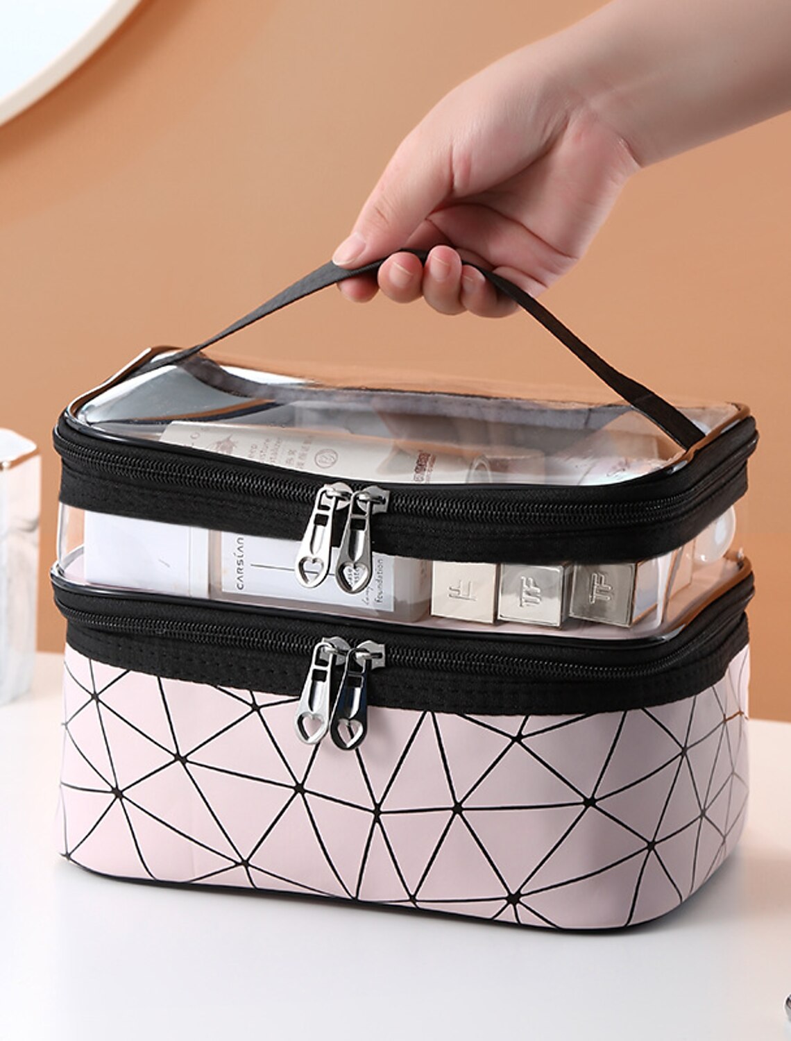 Travel cosmetic bag with simple, clear design.