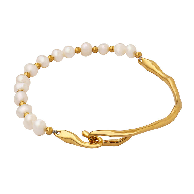 Fashionable titanium steel bracelet adorned with natural pearls.