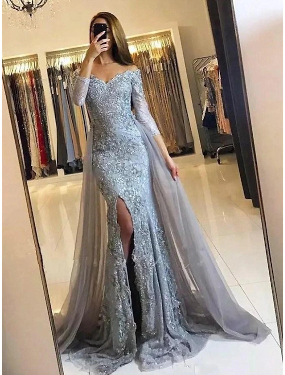 Close-up of the floral appliques and slit detail on the Mermaid Trumpet dress.