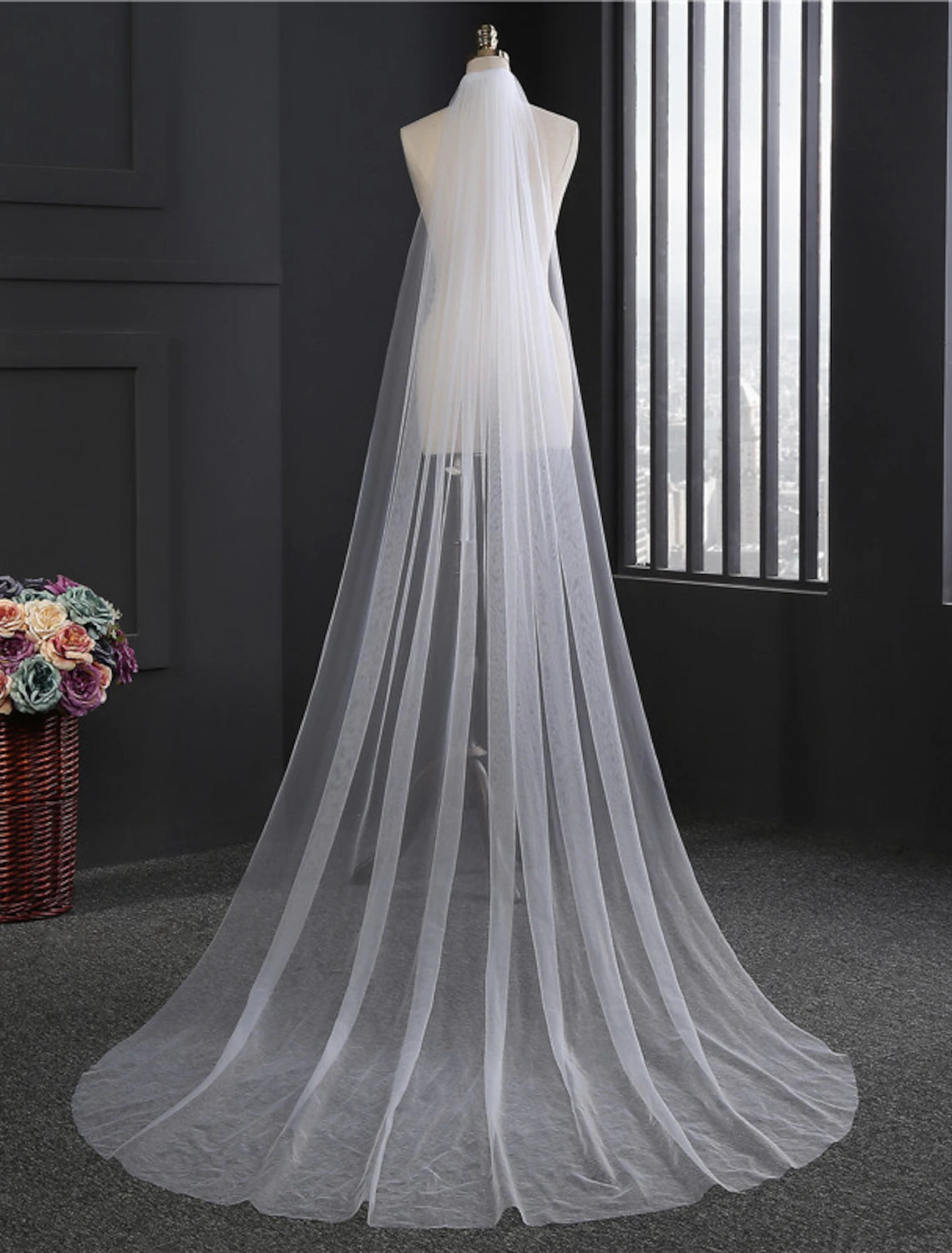 Close-up of the flower comb on a one-tier tulle wedding veil.