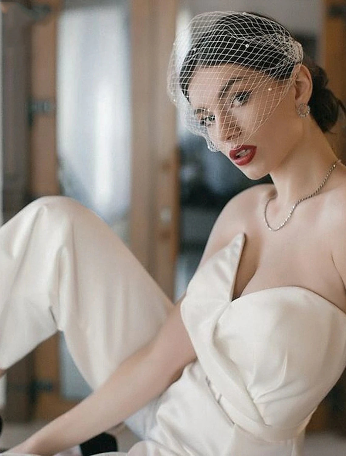 Side profile of a bride showcasing a European style wedding veil.
