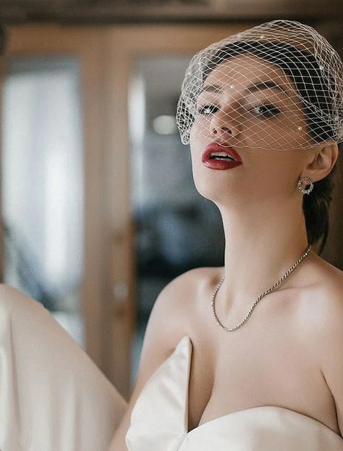 Wedding veil with subtle faux pearl embellishments on soft tulle.