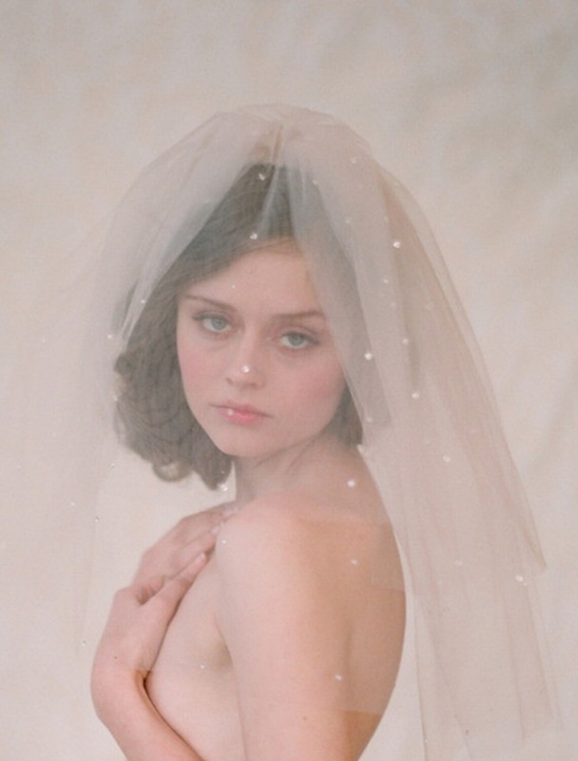 Close-up of the sparkling rhinestone and crystal details on the wedding veil.