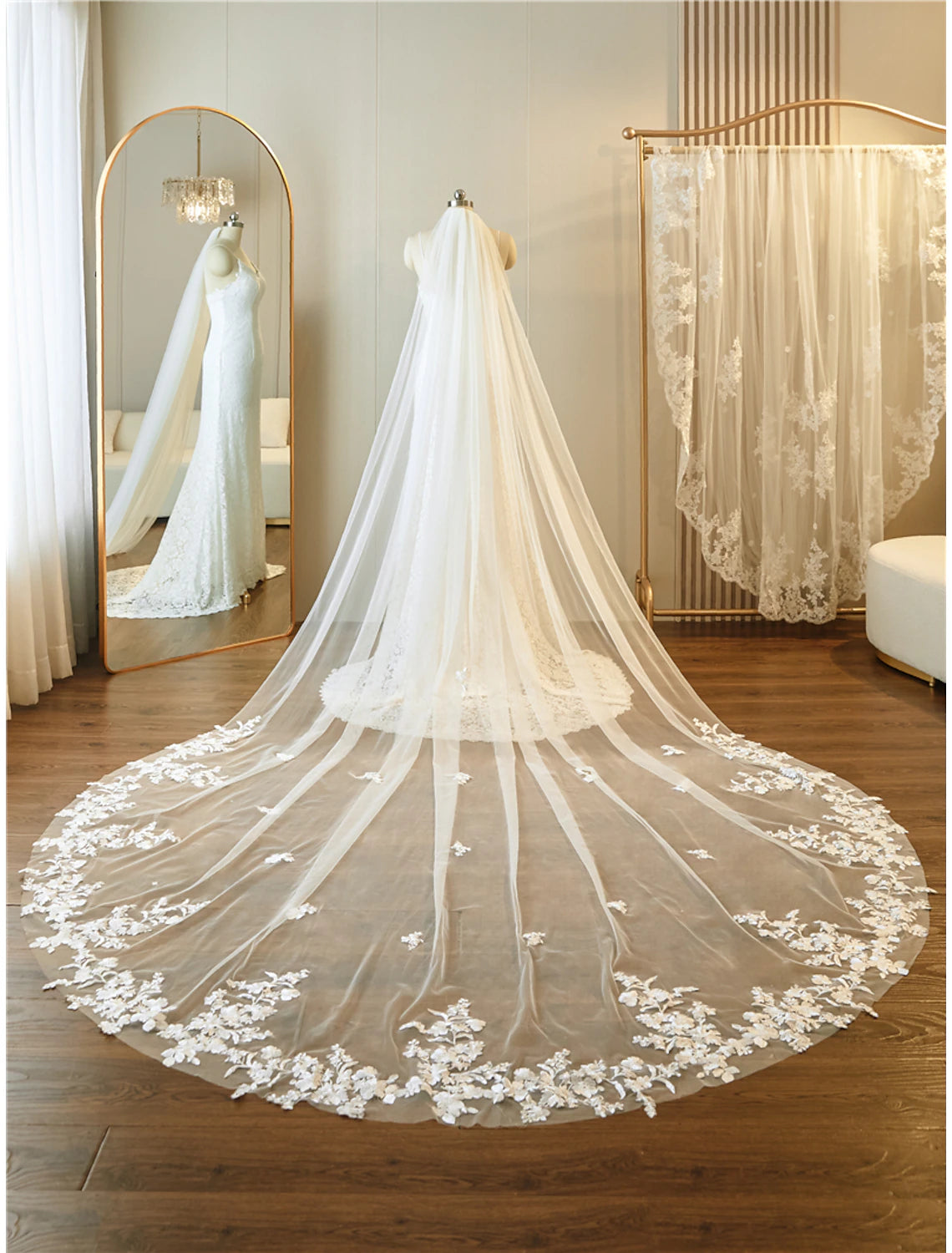 Bride from behind showcasing a long one-tier lace cathedral wedding veil.