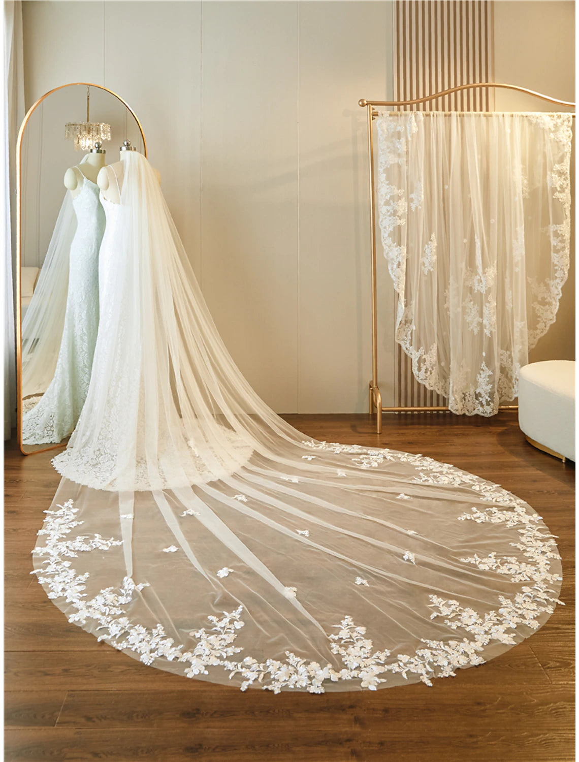 Close-up of delicate lace, embroidery, and paillette details on the wedding veil.