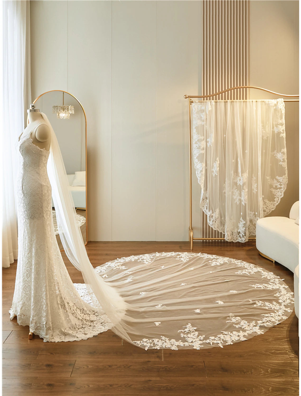 Bride from the side, showing the intricate embellishments and length of the bridal veil.