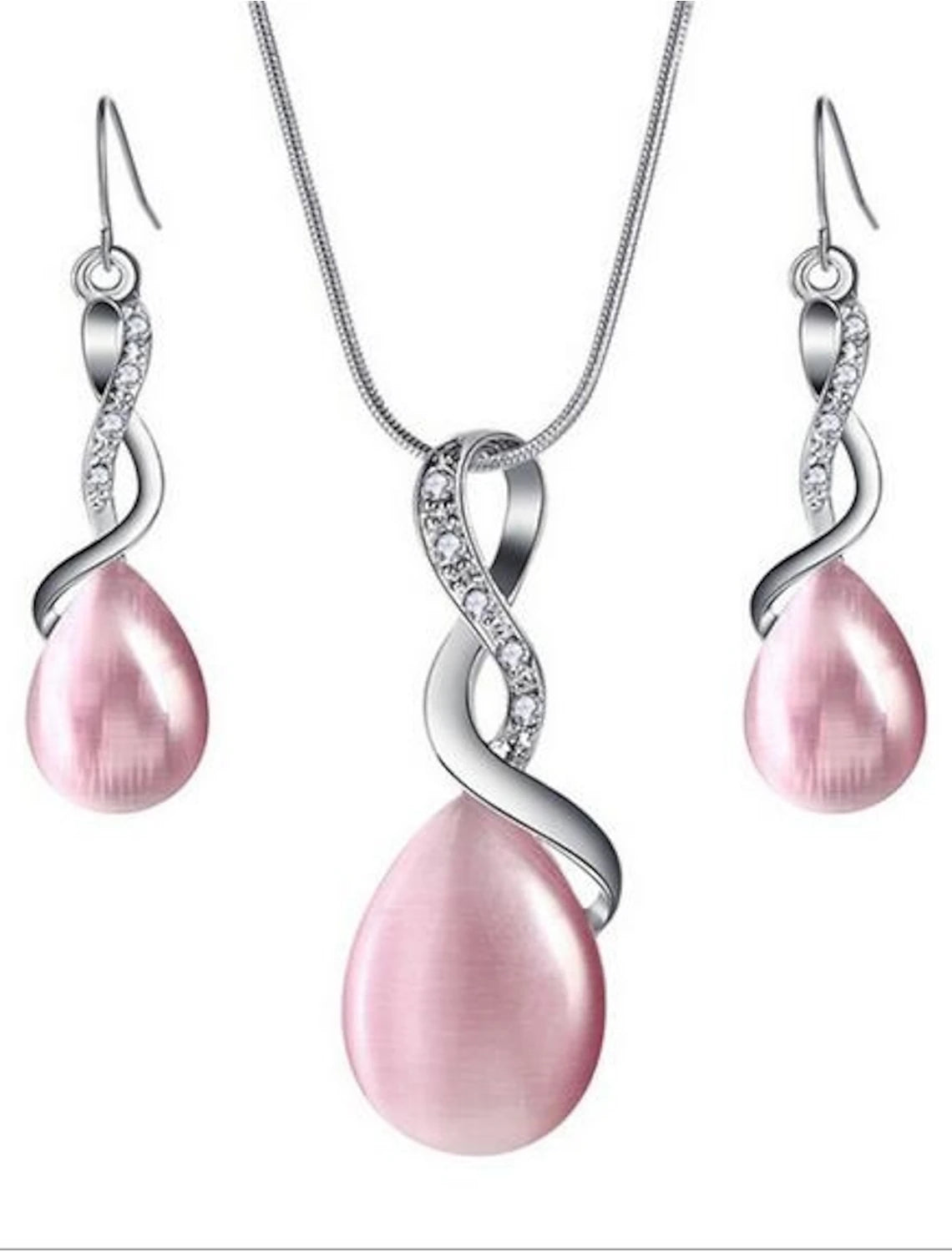 Woman wearing an opal crystal drop earring and infinity pear pendant necklace set.