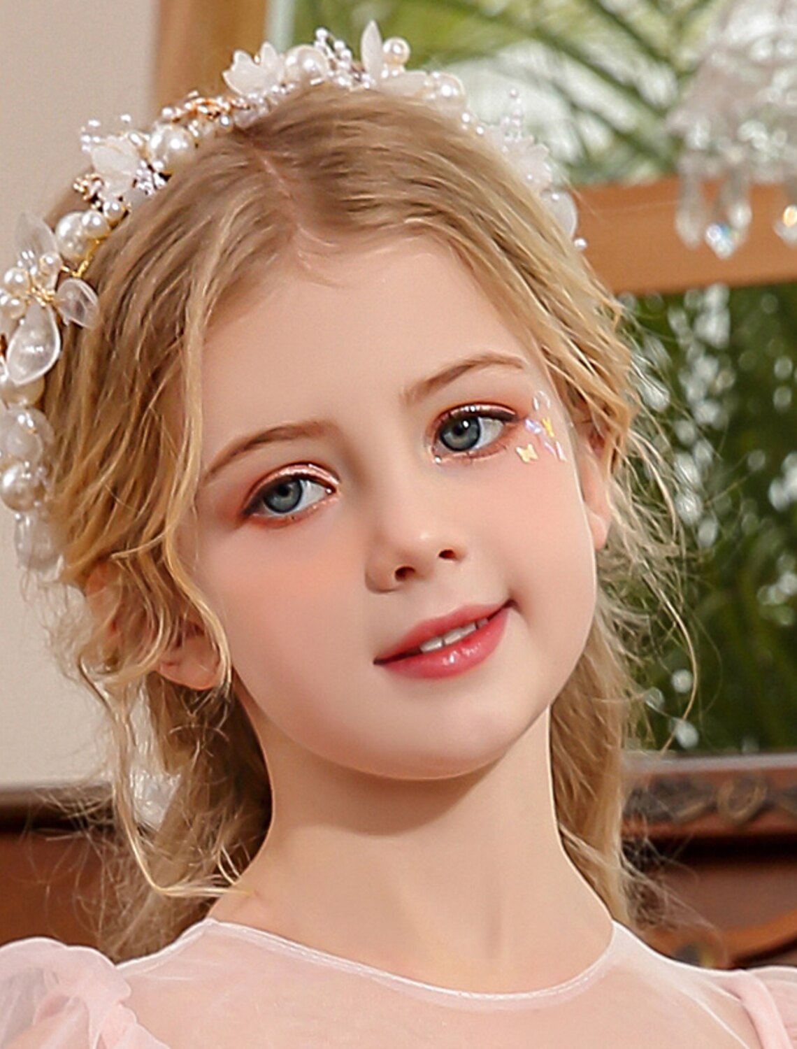 Pearl and rhinestone tiara headband with a delicate, sparkling design.