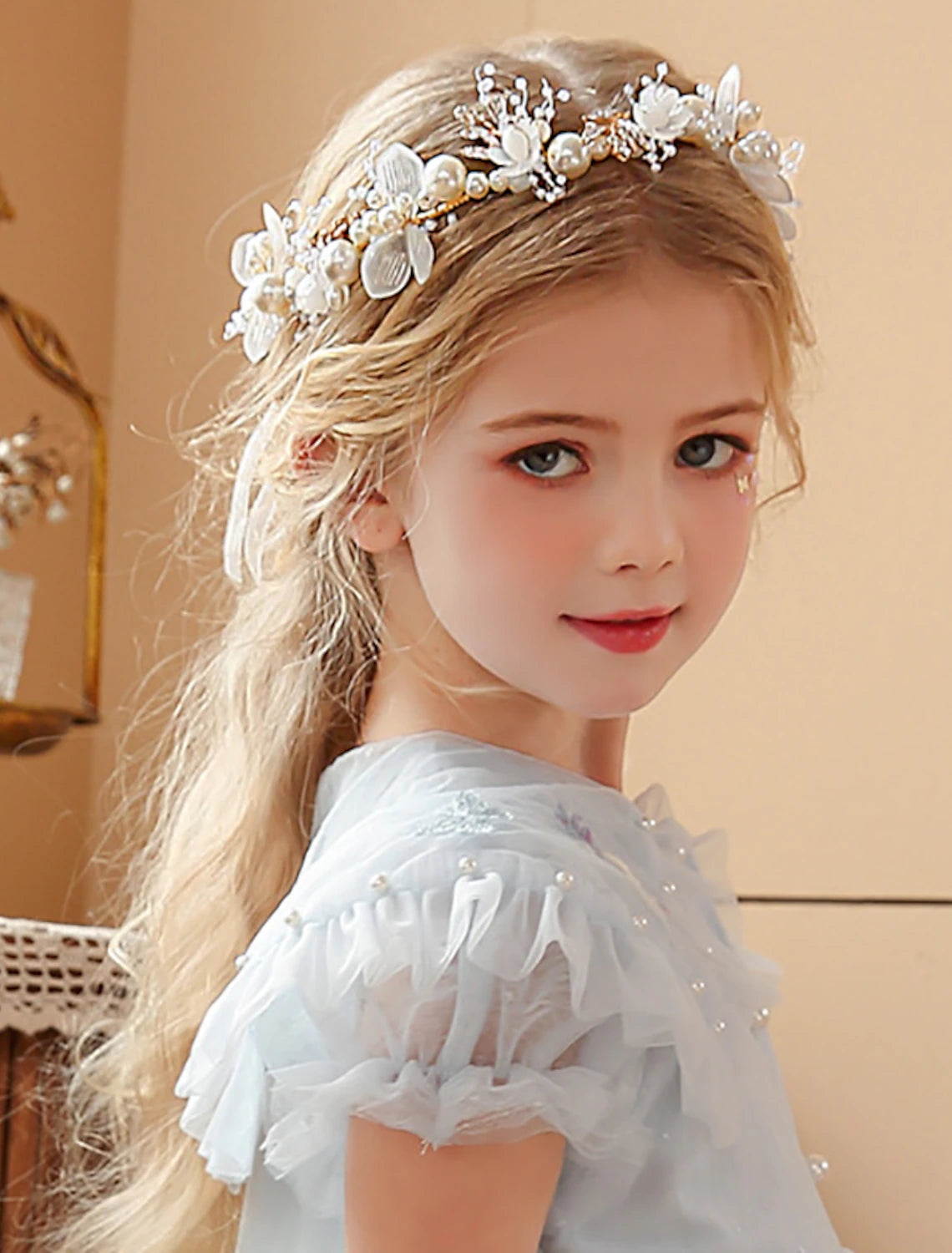 Pearl and rhinestone tiara headband from an elevated angle.