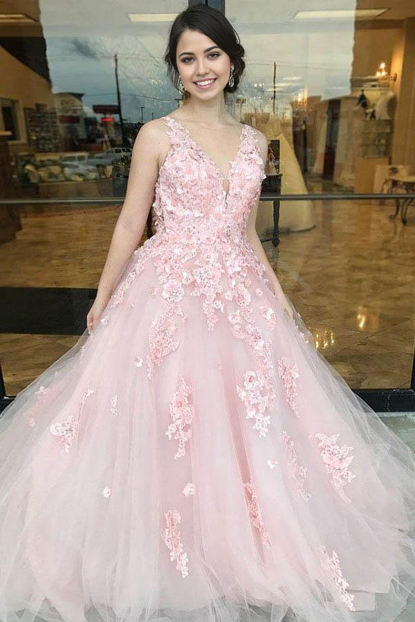 Pink A-line prom dress with deep V-neck, appliques, and sweep train, shown from the front.