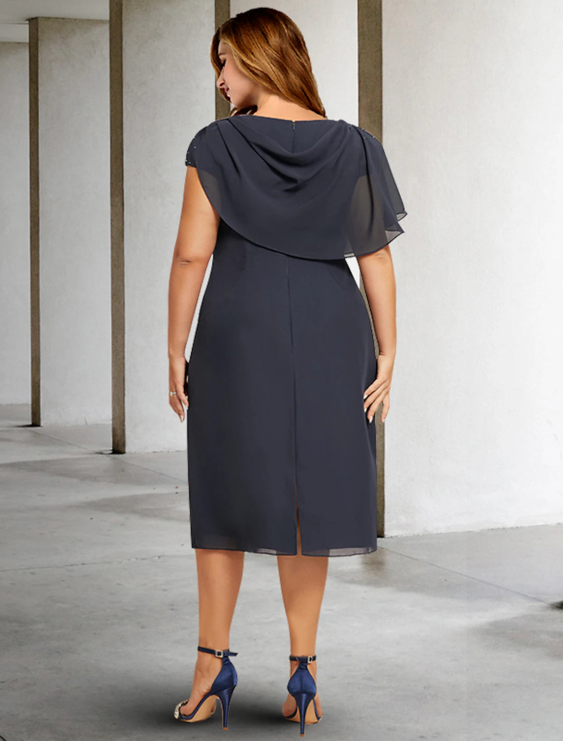 Close-up of the ruched bodice and jewel neck of the A-line chiffon dress.