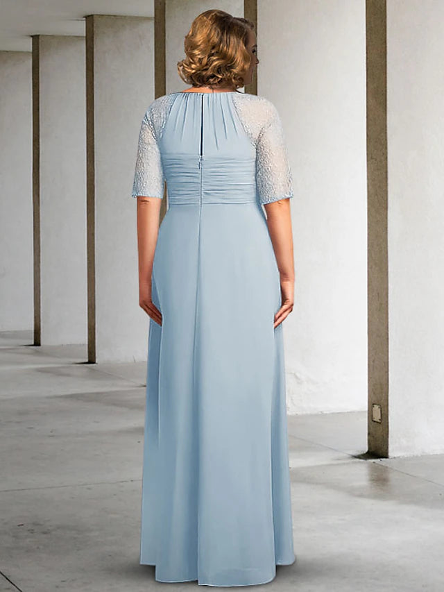 Elegant floor length chiffon lace gown with ruched and pleated details.