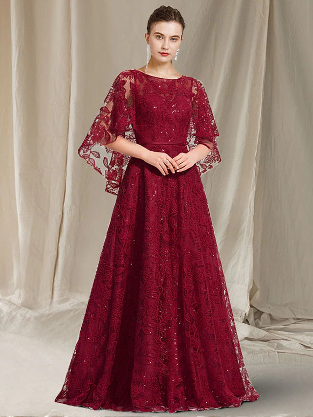 Elegant plus size A-line mother of the bride dress with jewel neck, lace, and sequin appliques.