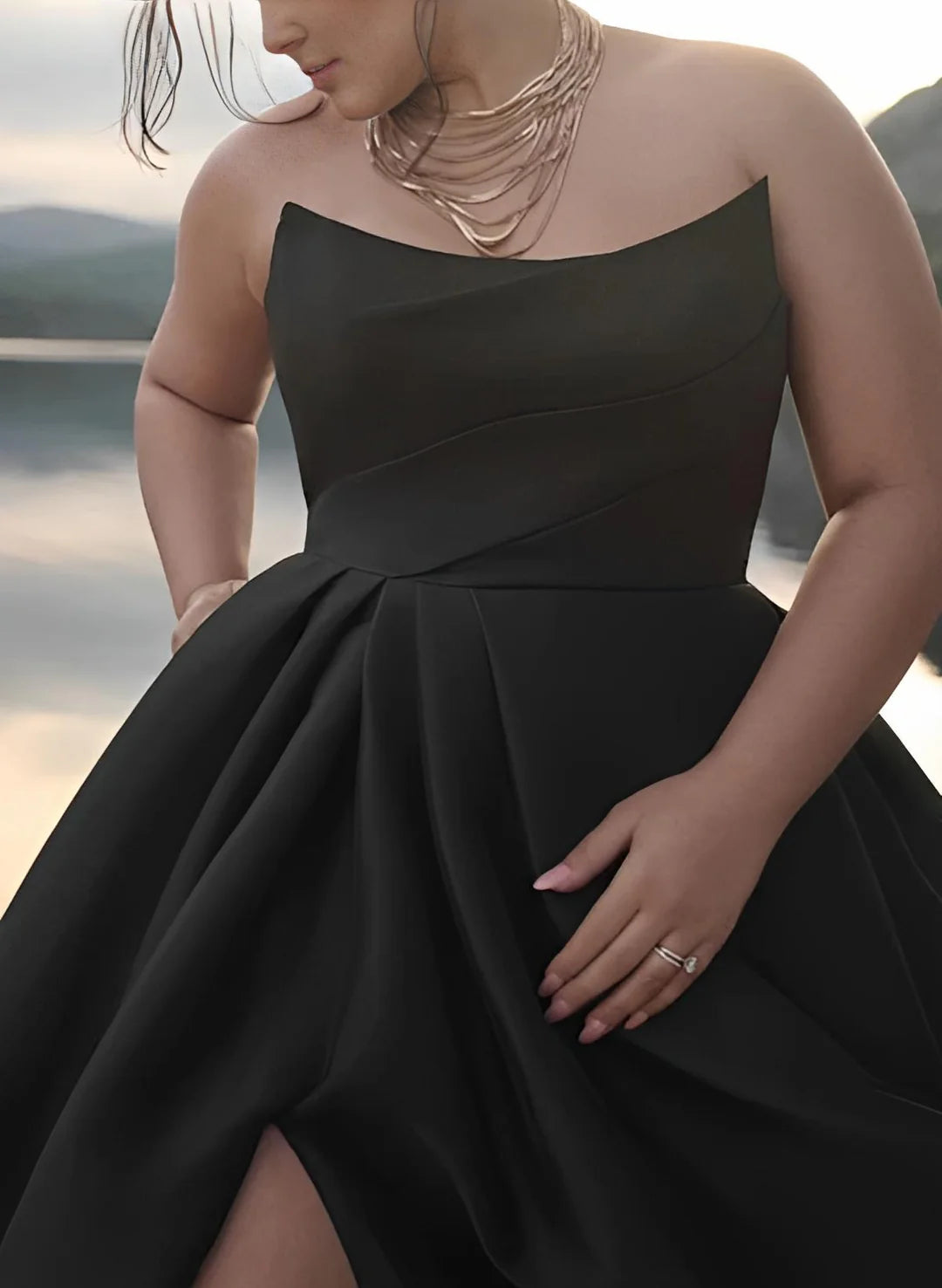 Close-up of the bodice of a white strapless A-line wedding dress.