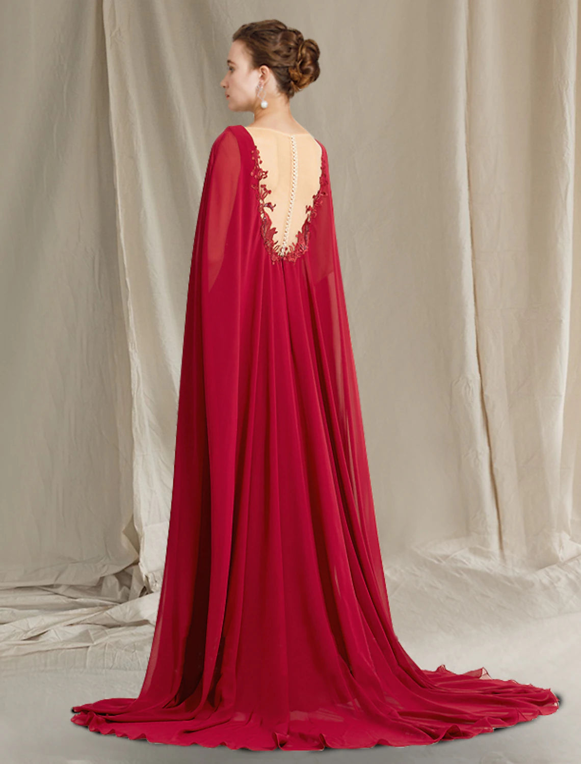 Back view of plus size formal gown with sequin appliques.