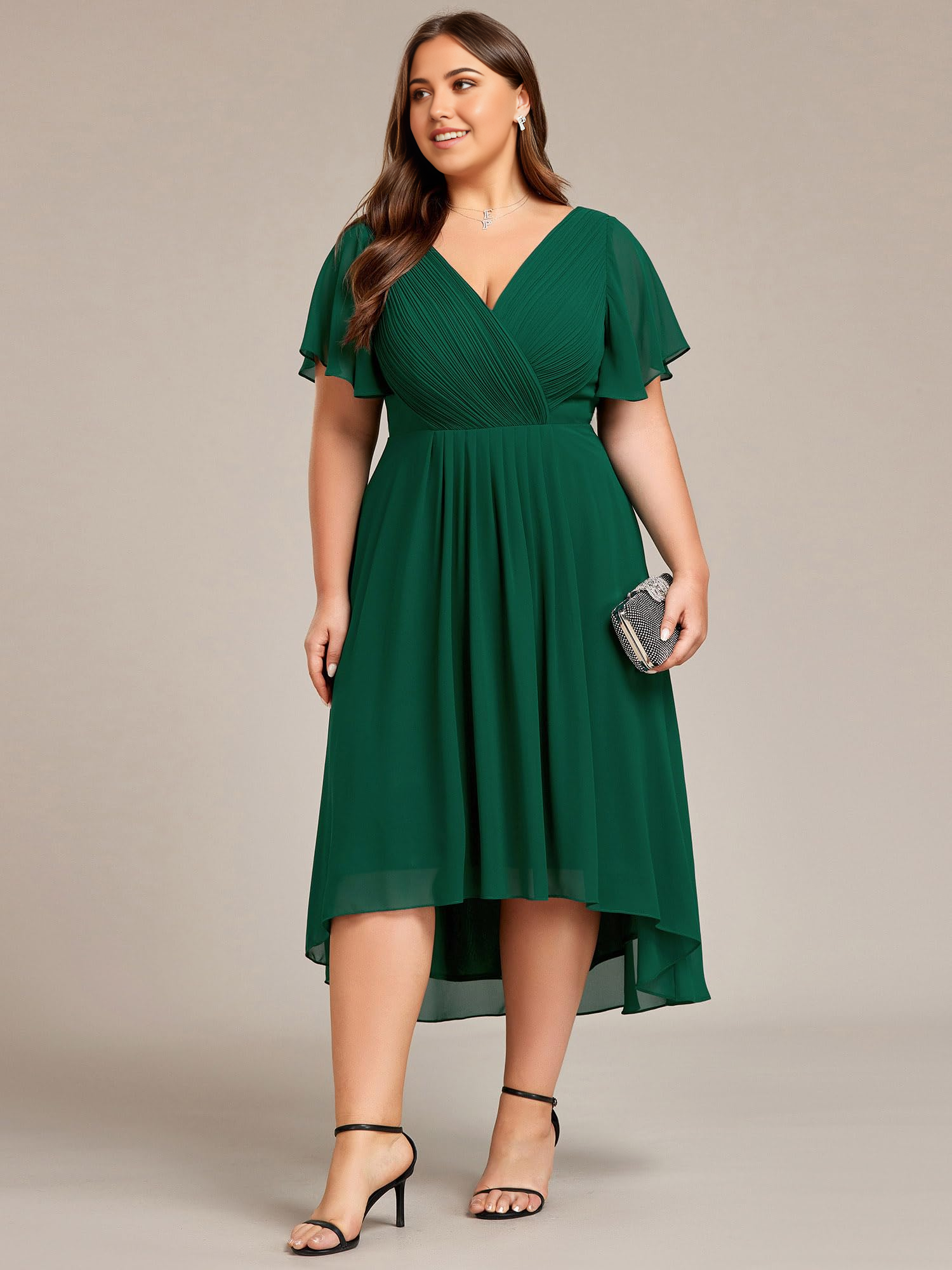 Plus size model wearing an A-line V-neck chiffon knee-length formal dress with short sleeves.