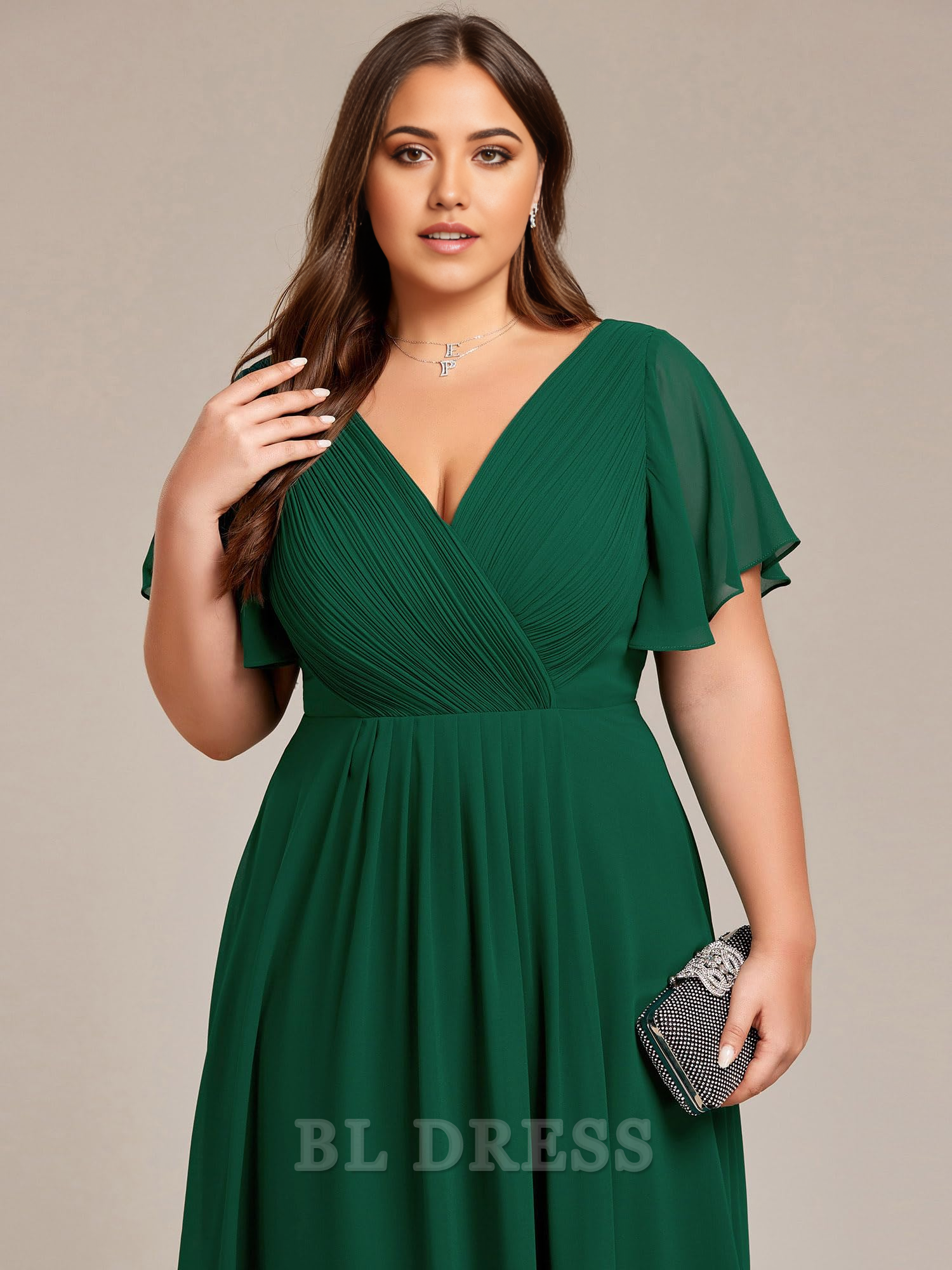 Plus size model showcasing the elegant drape of an A-line V-neck chiffon short sleeve dress.