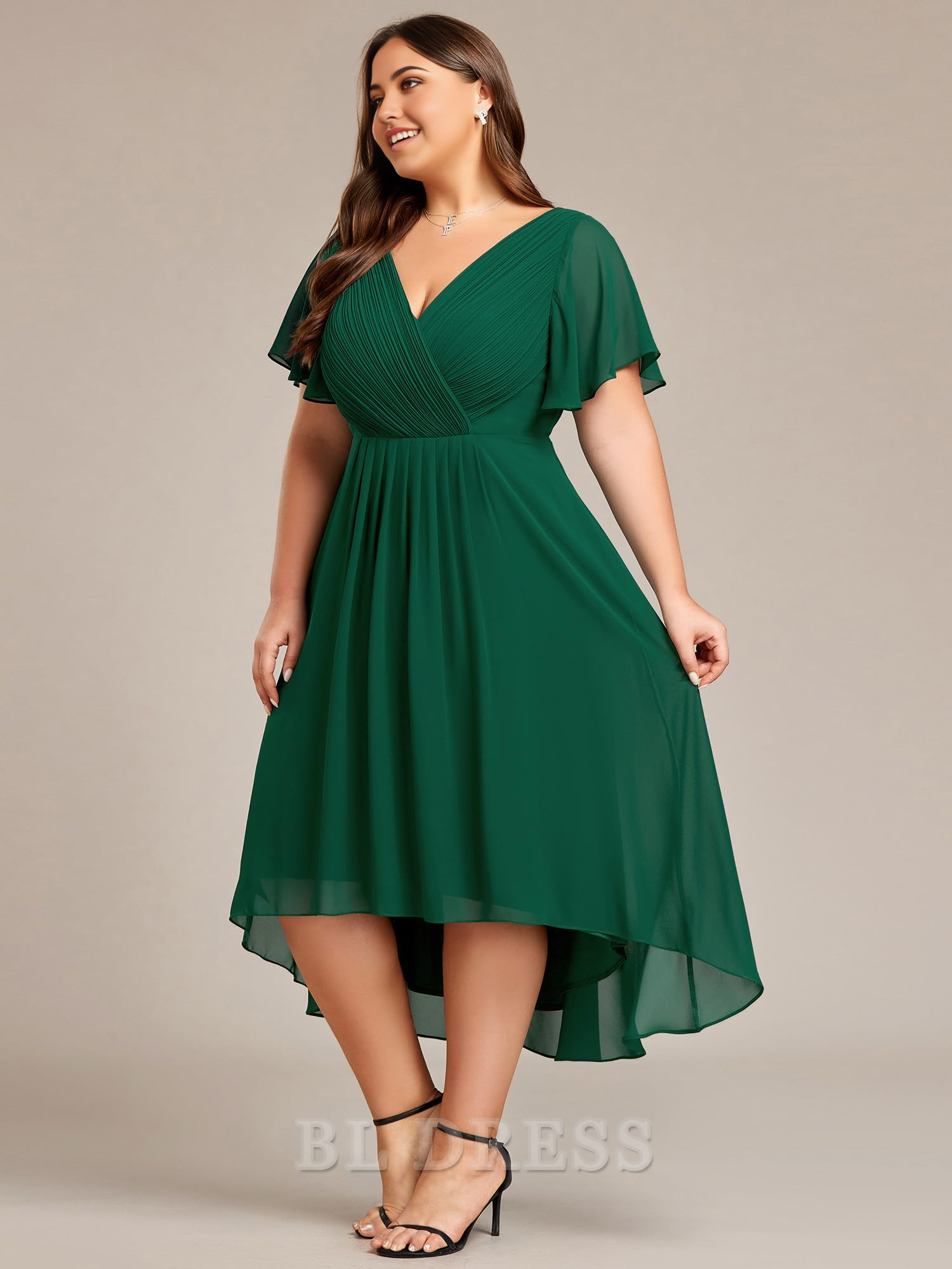 Plus size model in a knee-length A-line V-neck chiffon dress, highlighting the short sleeves.