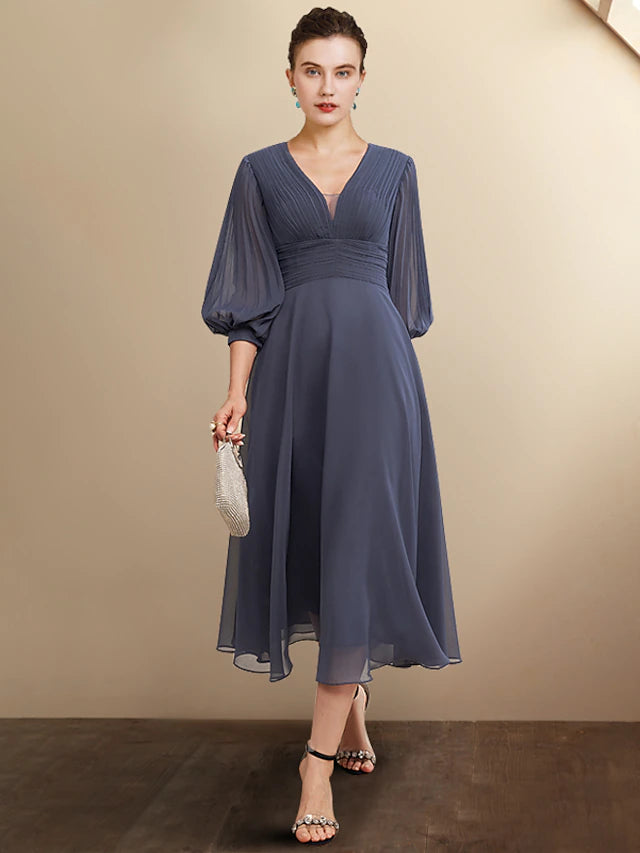 Woman wearing an elegant plus size A-line V-neck chiffon tea length dress.