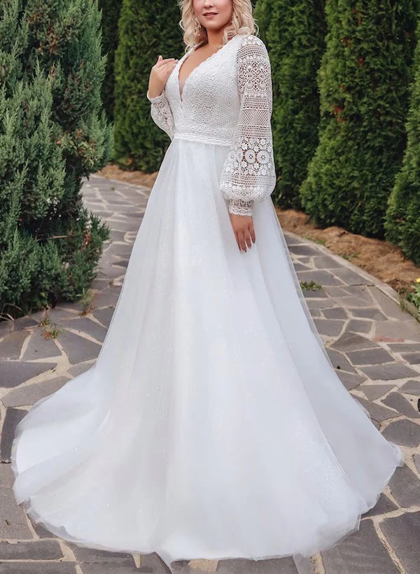 Front view of elegant plus size A-line V-neck wedding dress with lace applique.