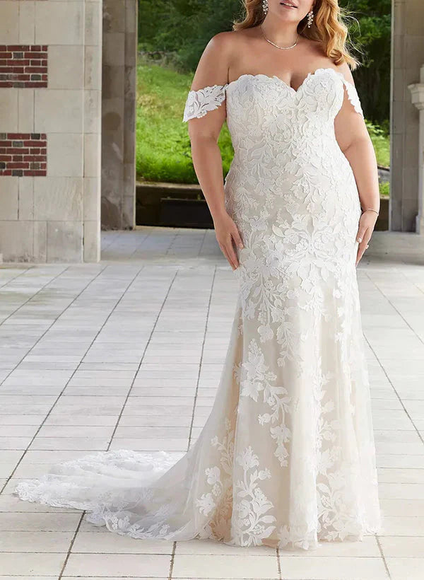 Plus size mermaid wedding dress with off-shoulder neckline and lace appliques.