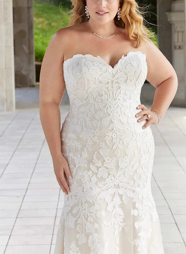 Detail of the intricate lace appliques on the wedding dress bodice.