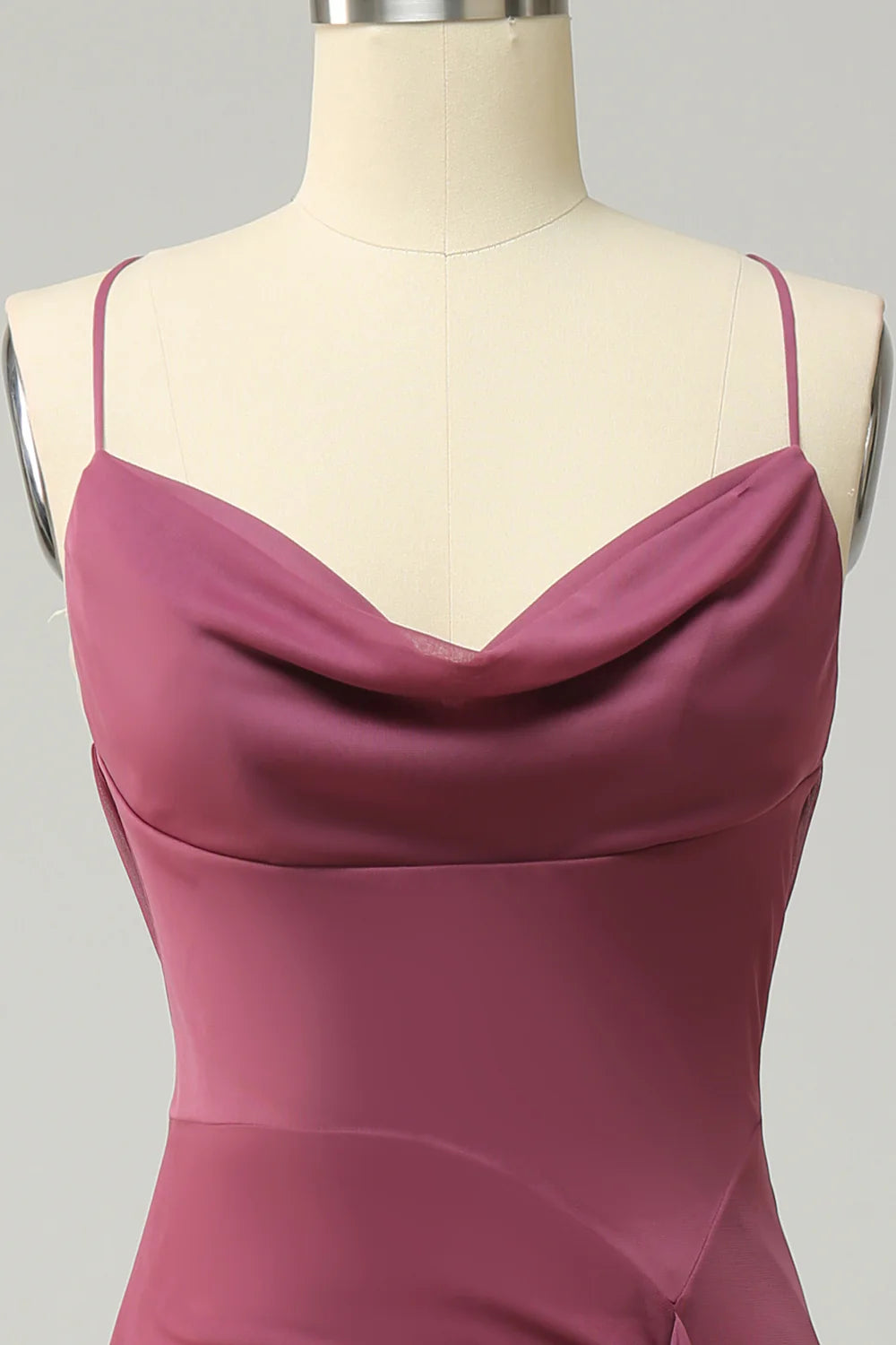 Detail of the V-neckline and spaghetti strap on a plus size formal dress.