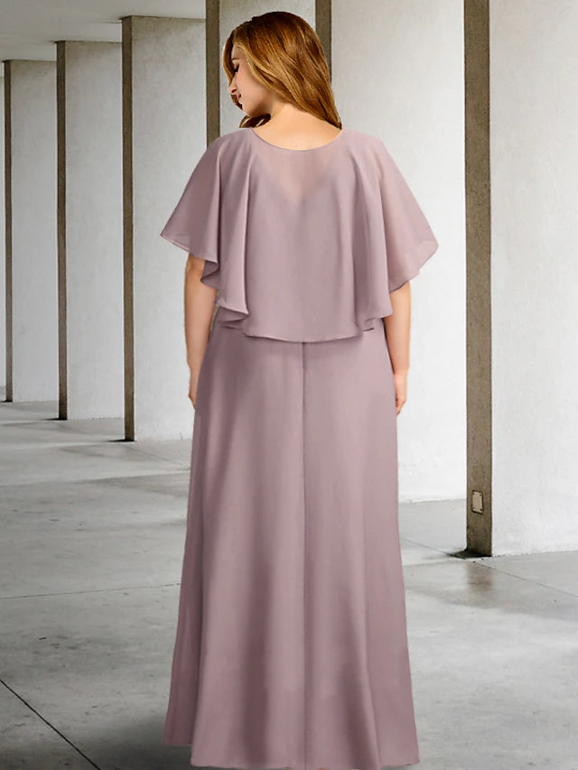 Close-up of the V-neck and pleated bodice of the two-piece chiffon dress.