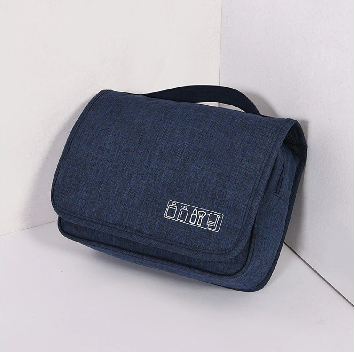 Open portable cosmetic bag showing multiple compartments.