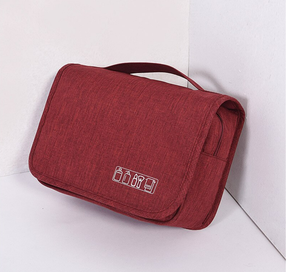 Interior view of the travel cosmetic bag with storage pockets.