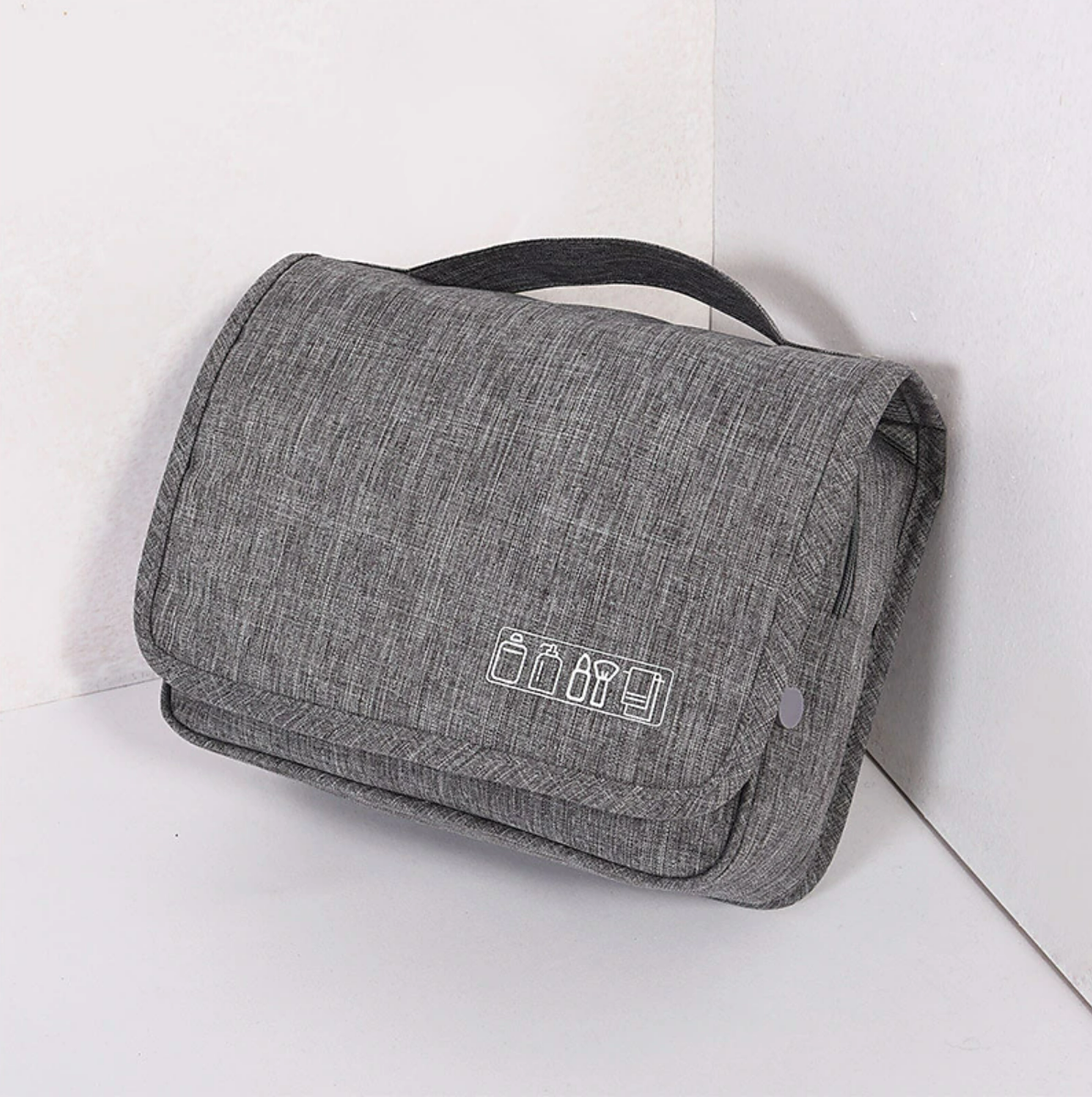 Portable cosmetic bag with a hand hook for hanging.
