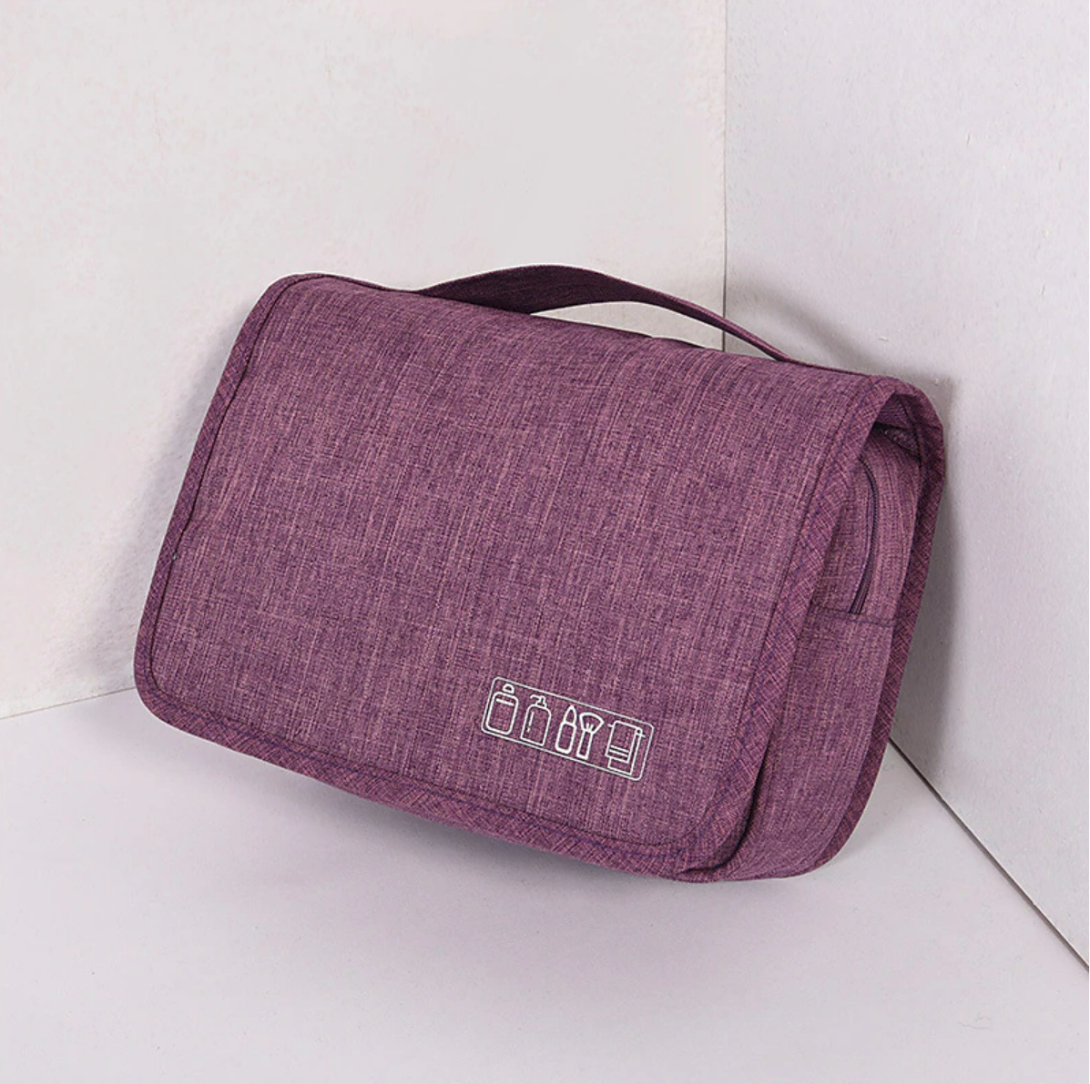 Portable cosmetic bag displaying its spacious interior.