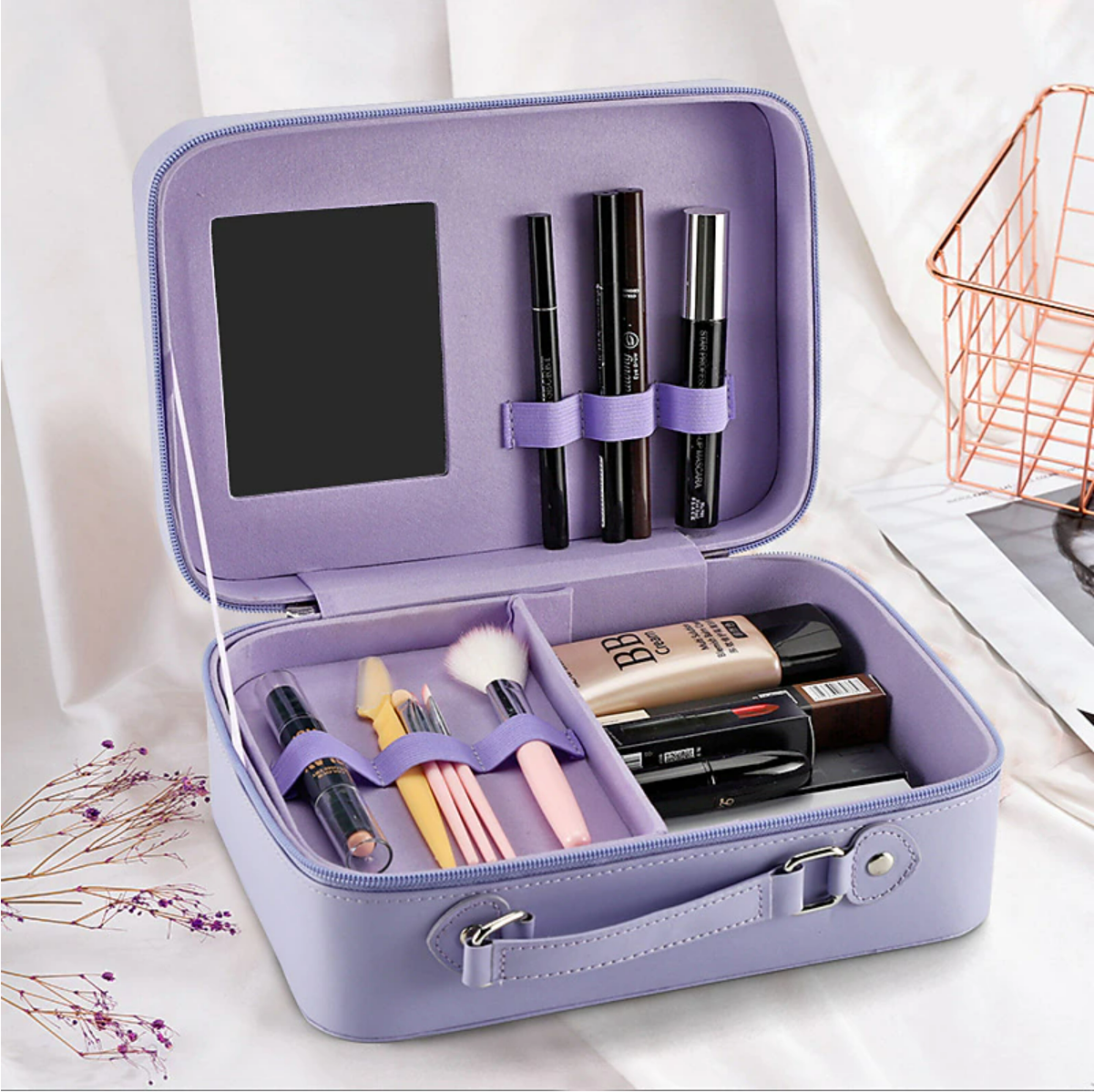 Portable cosmetic organizer bag open with adjustable dividers.