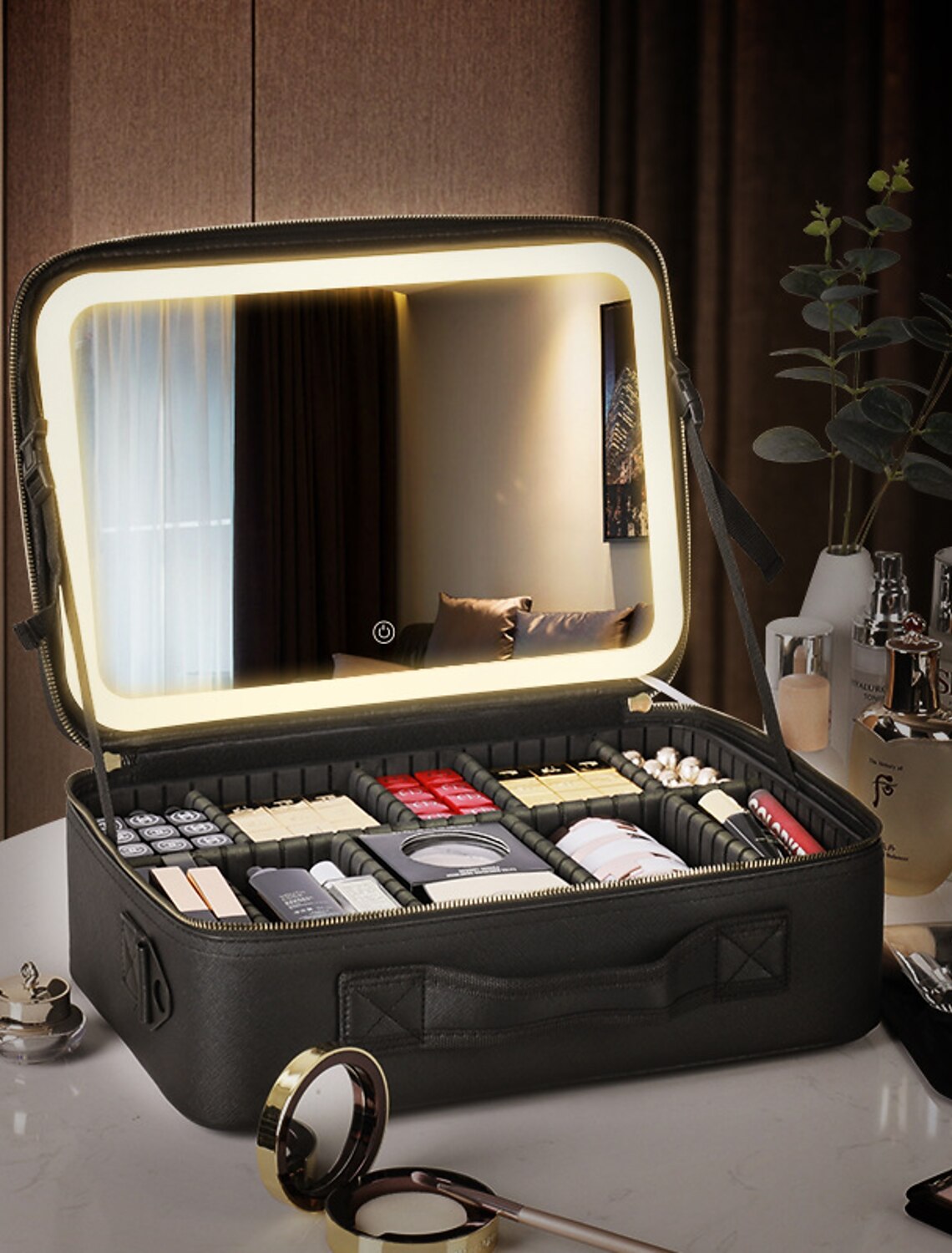 Close-up of the LED lighted mirror and magnifying lens inside the makeup bag.