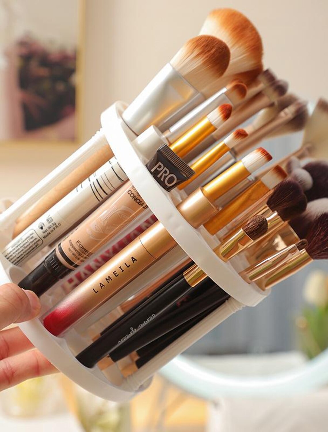 Empty transparent makeup brush storage bucket.