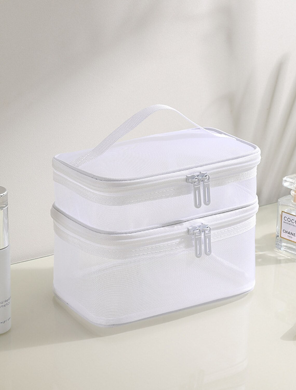 Double layer mesh cosmetic bag, open view.