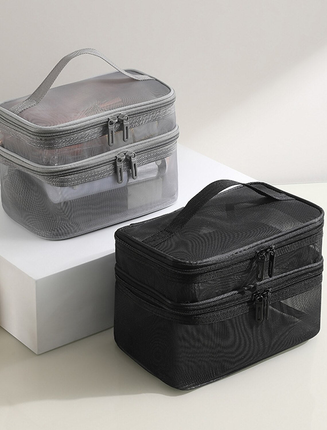 Front view of mesh cosmetic storage bag.
