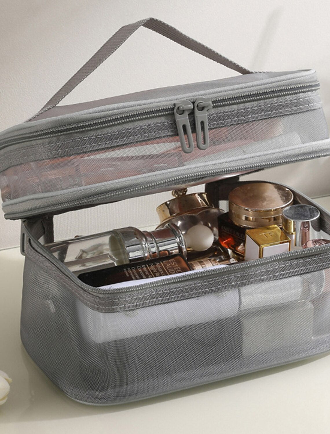 Mesh wash bag for toiletries.