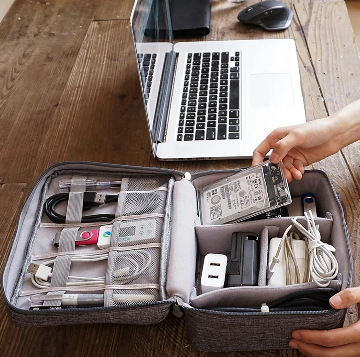 Compact travel cable organizer bag with zipper closure.