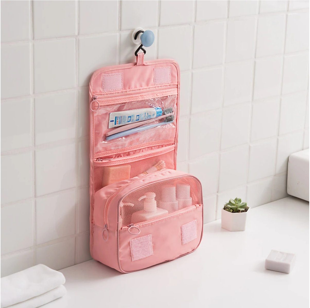 Open waterproof wash bag with multiple compartments.