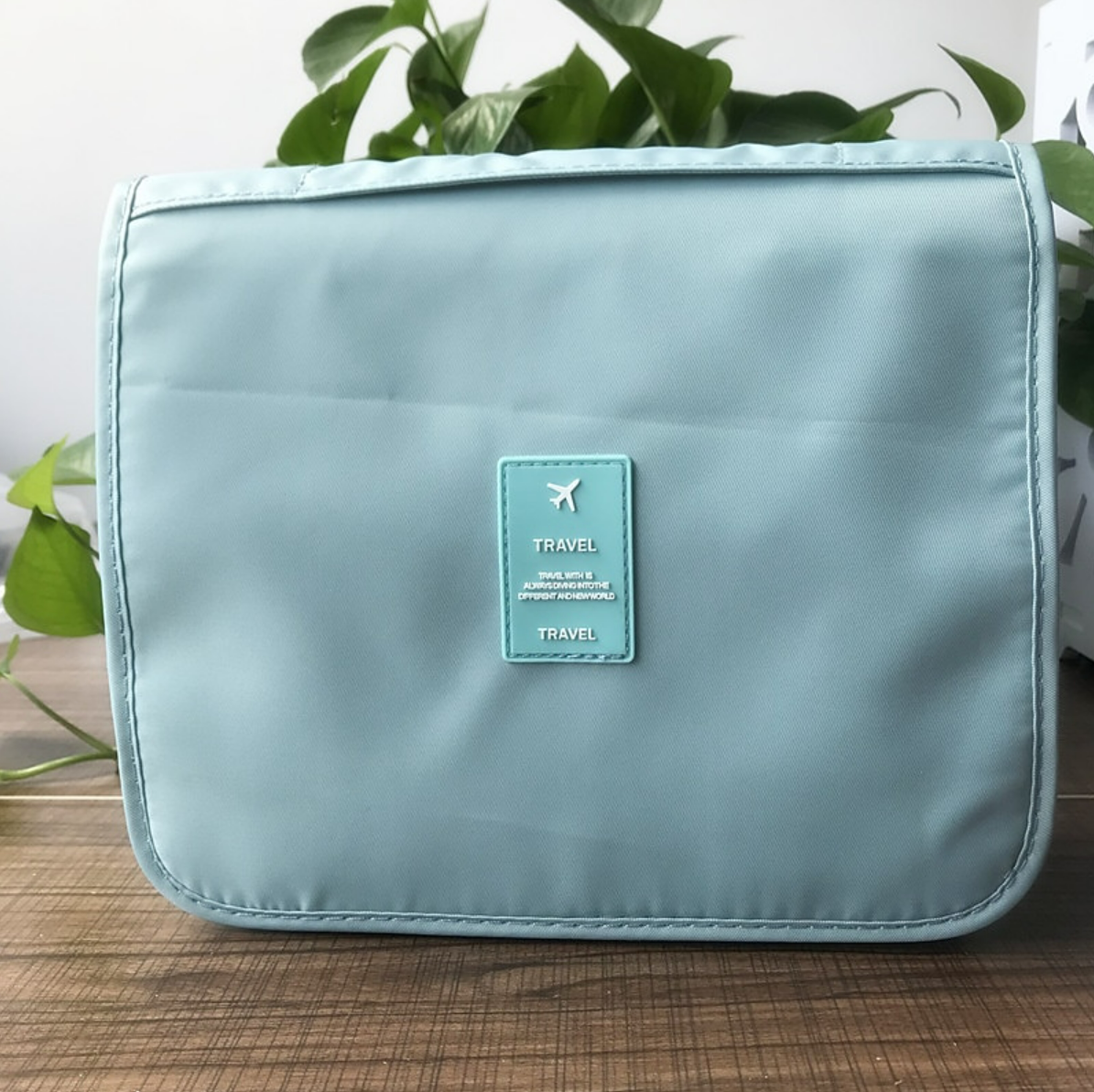Large capacity travel organizer bag filled with toiletries.