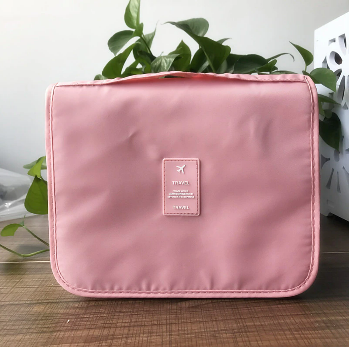 Detail of waterproof twill fabric and zipper on wash bag.
