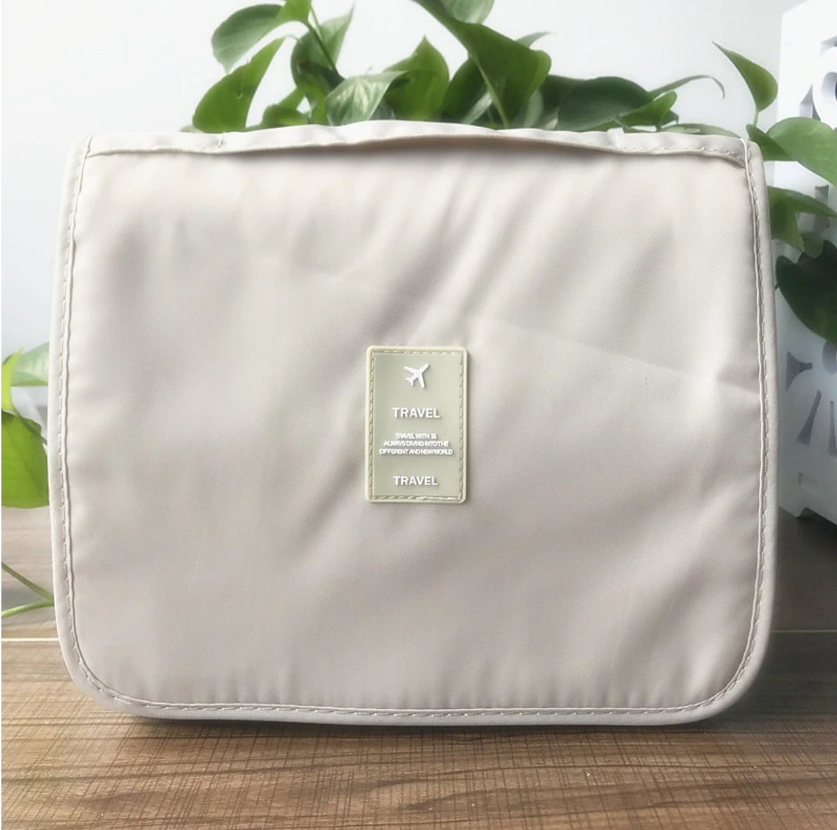 Unisex travel wash bag in a modern bathroom setting.