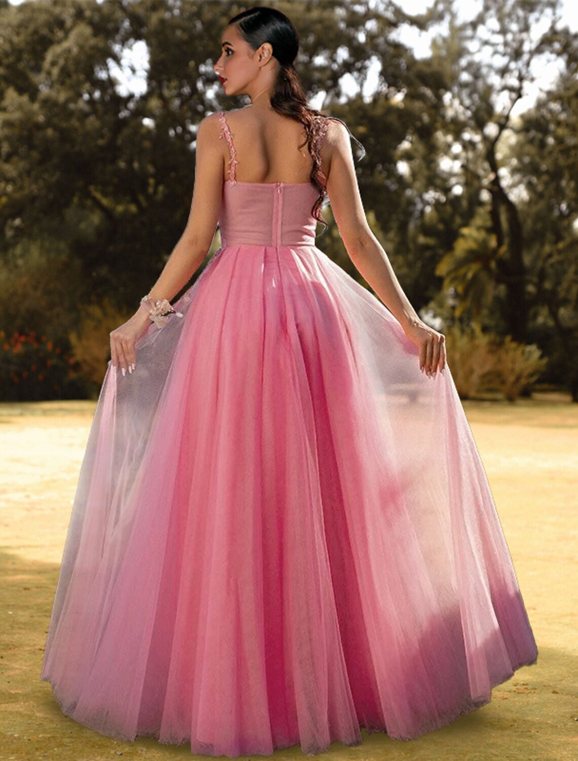 Close-up of the light blue tulle skirt and appliques on the A-line prom dress.