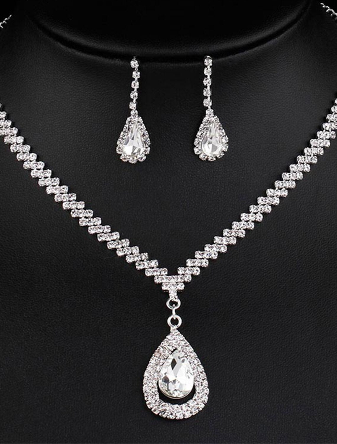 Rhinestone tennis chain necklace and matching drop earrings set.