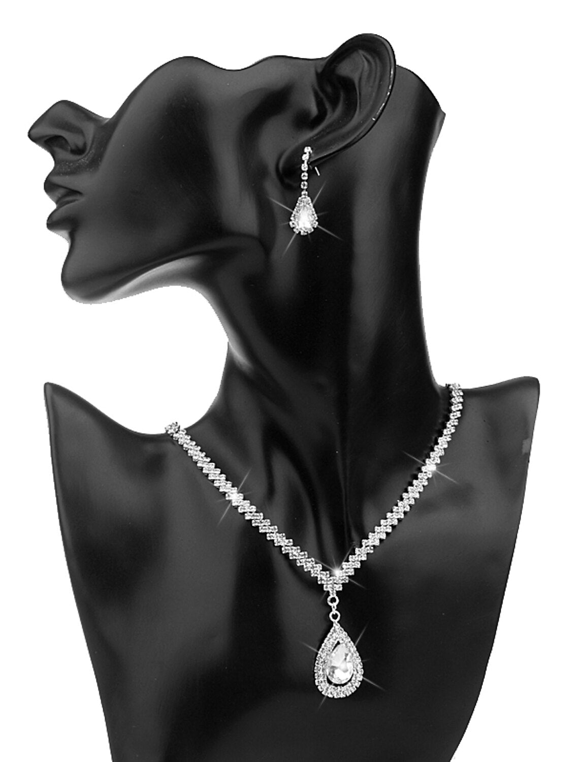 Close-up of sparkling rhinestone drop earrings.