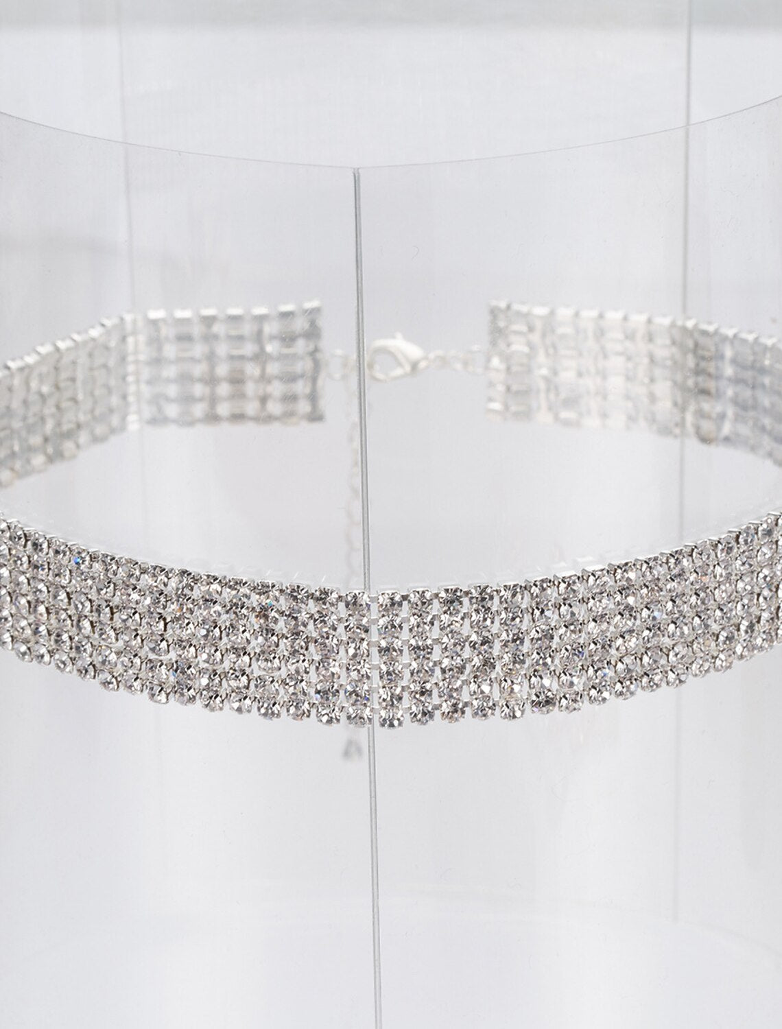 Close-up of a rhinestone necklace with geometric design.