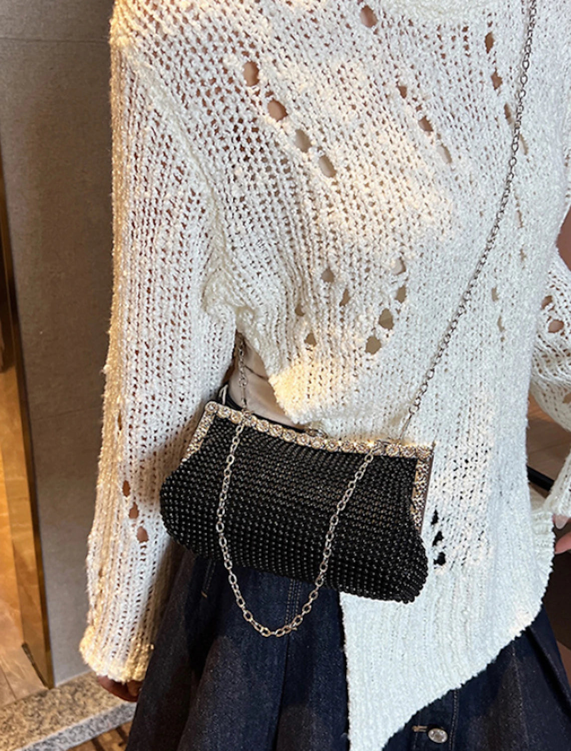 Women's rhinestone chain evening clutch bag, front view.
