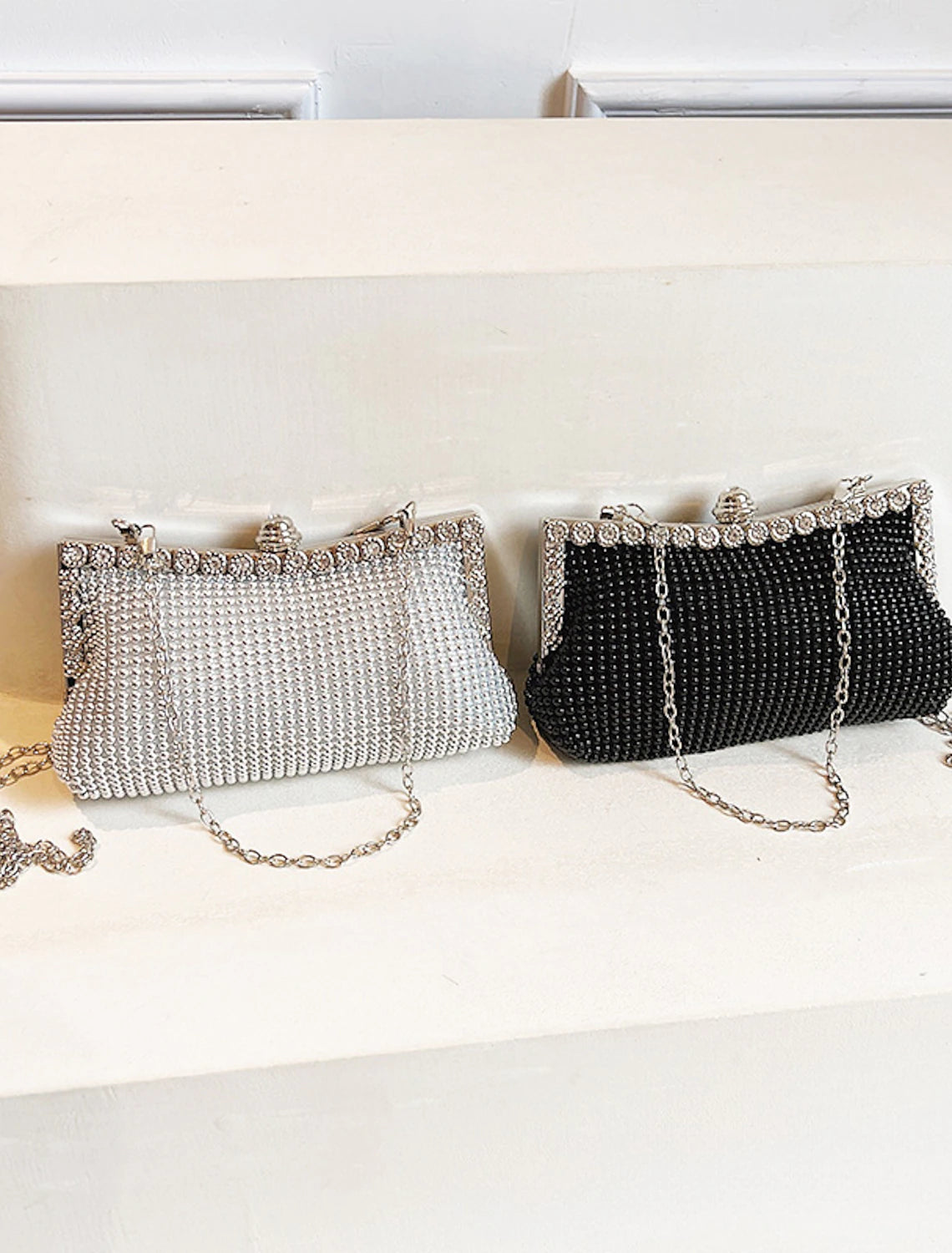 Close-up of the rhinestone chain on the evening clutch.