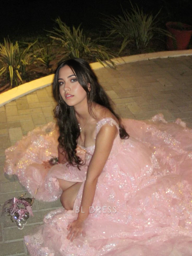 Blush pink A-line formal gown with off-shoulder sweetheart neckline and sequin lace bodice.
